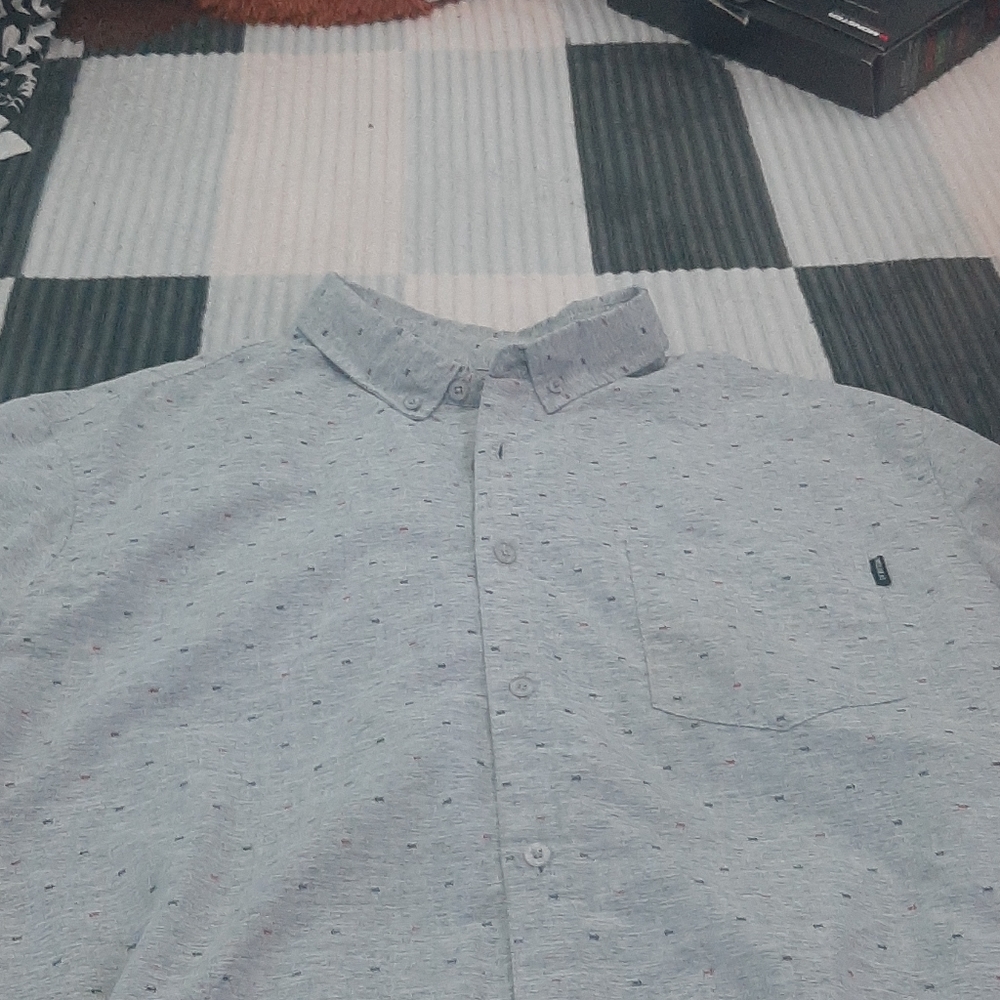 Short sleeve green button up.
